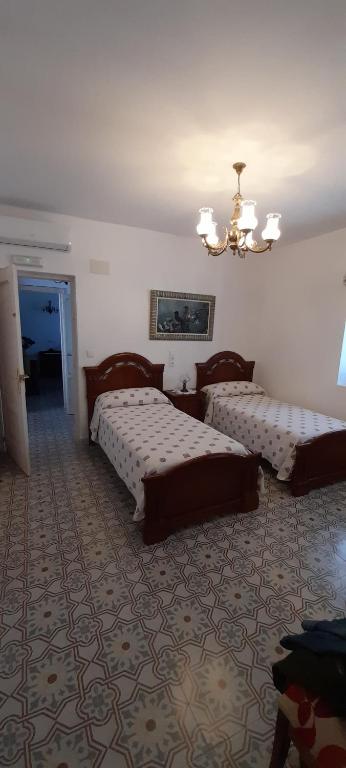Postel nebo postele na pokoji v ubytování Casa rural La Golondrina