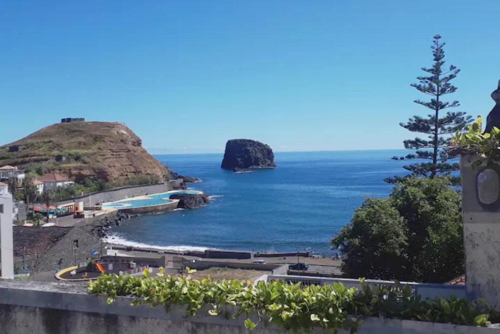 a view of the ocean from a hill at Valentina's House in Porto da Cruz