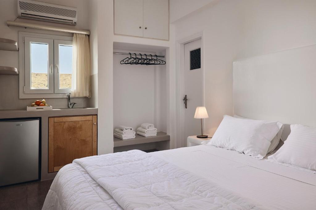 A bed or beds in a room at Kanala Studios