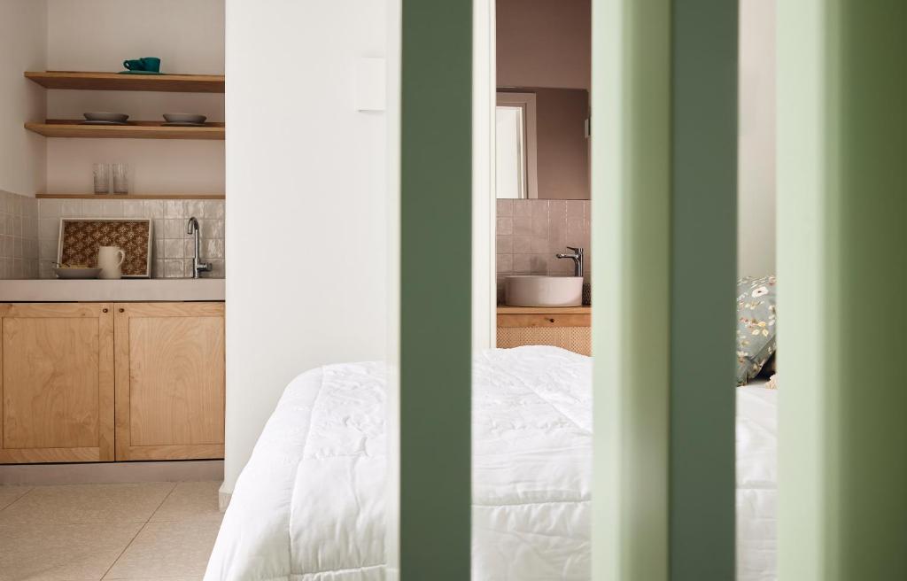 A bed or beds in a room at Kanala Studios