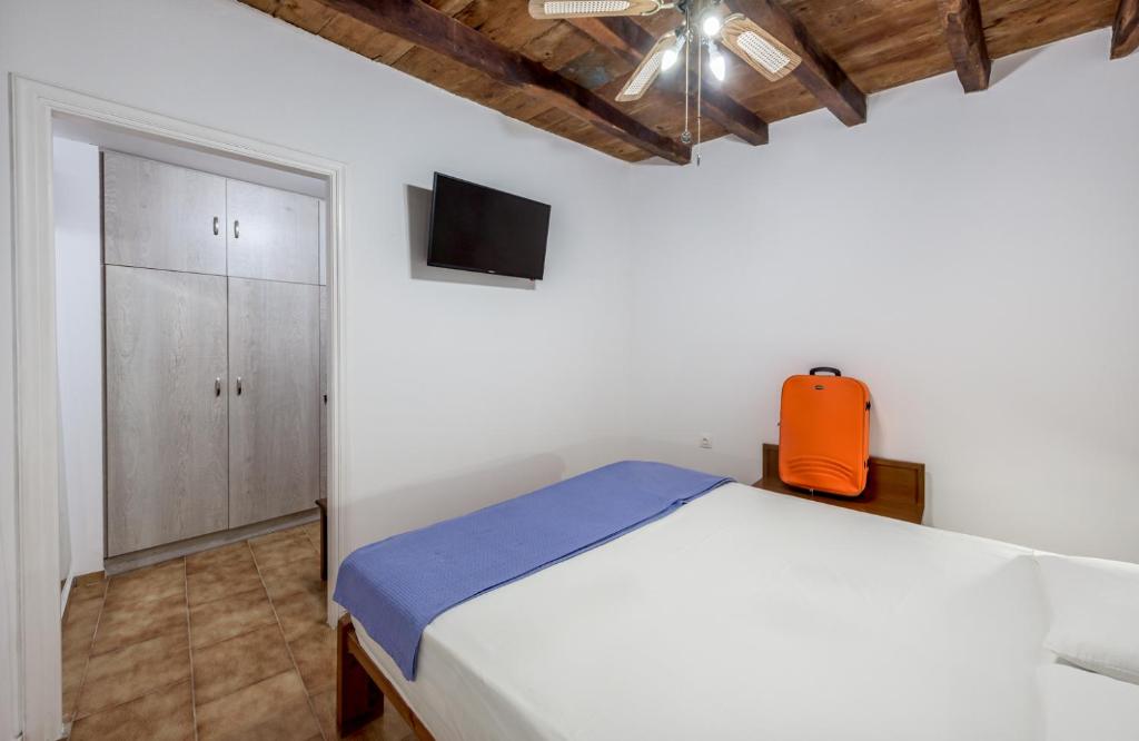Postel nebo postele na pokoji v ubytování Sofaki Milos