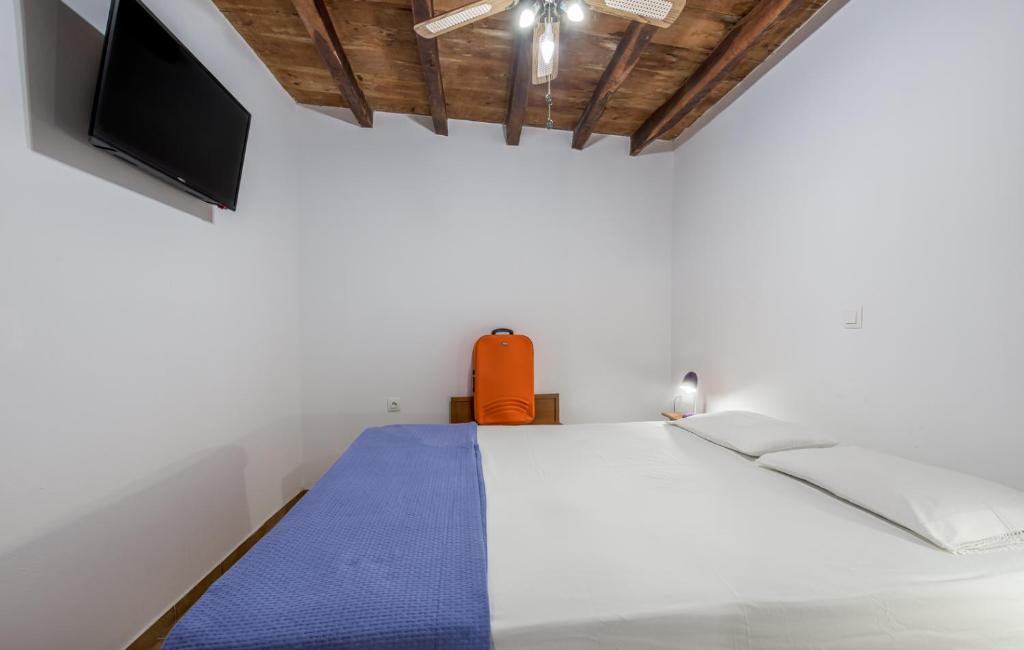 Postel nebo postele na pokoji v ubytování Sofaki Milos