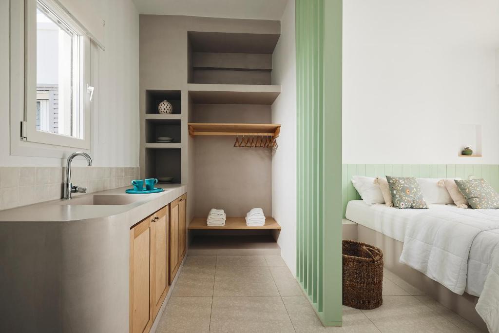 A bed or beds in a room at Kanala Studios