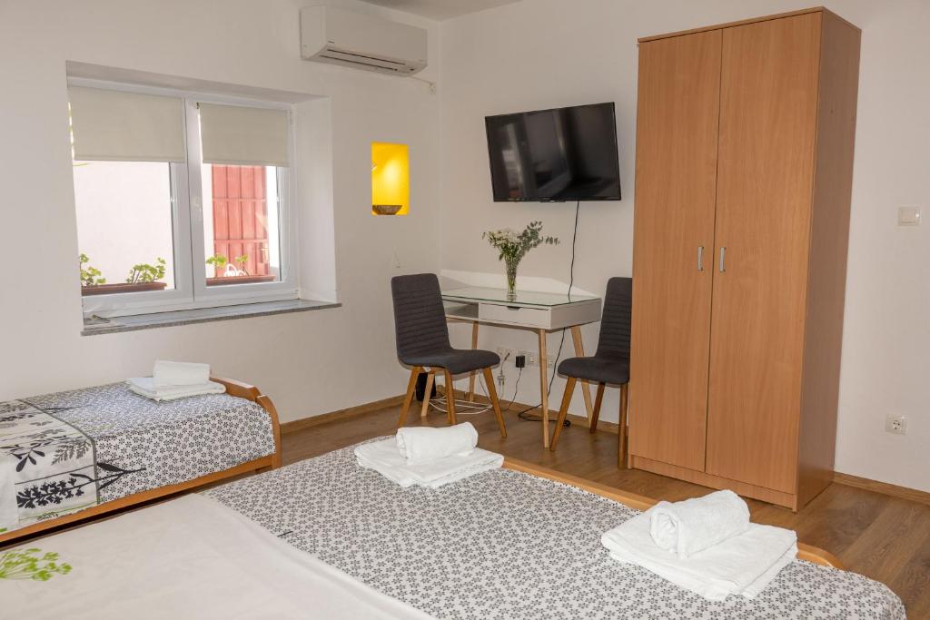Postel nebo postele na pokoji v ubytování Apartments Uno