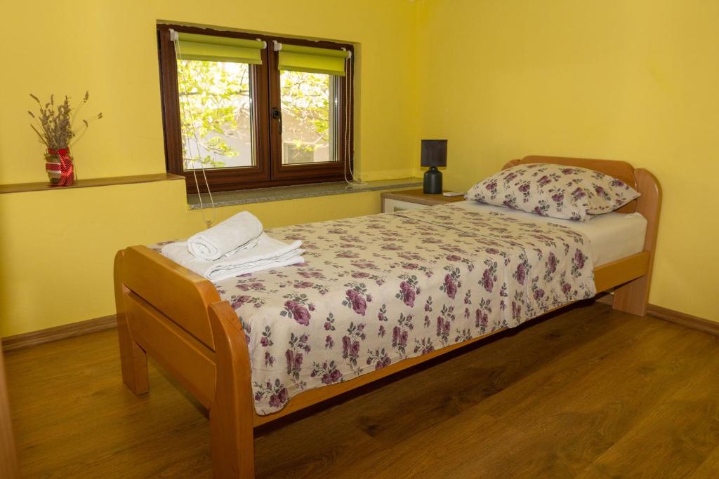 Postel nebo postele na pokoji v ubytování Apartments Uno