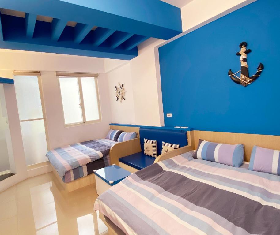 Katil atau katil-katil dalam bilik di CHI-YU B&B