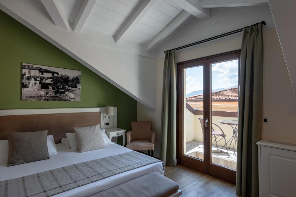 Postel nebo postele na pokoji v ubytování Hotel Garni Corona