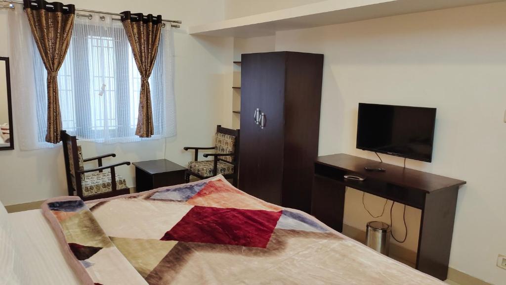 TV a/nebo společenská místnost v ubytování Royal Serene Villas