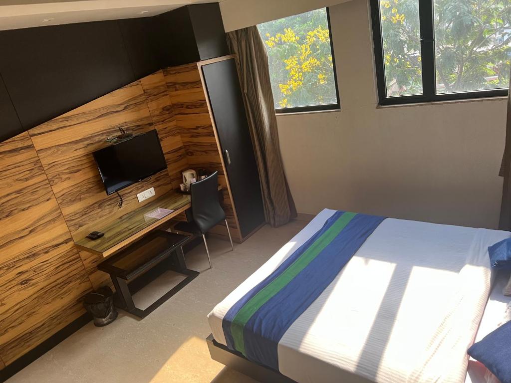 Postel nebo postele na pokoji v ubytování Hotel Aston International