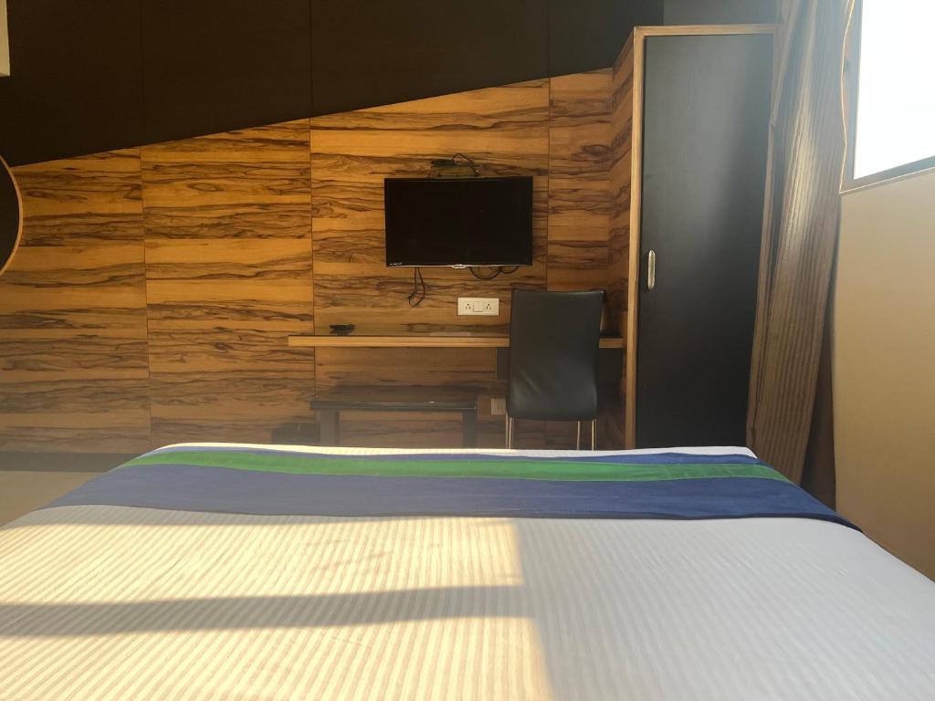 Postel nebo postele na pokoji v ubytování Hotel Aston International