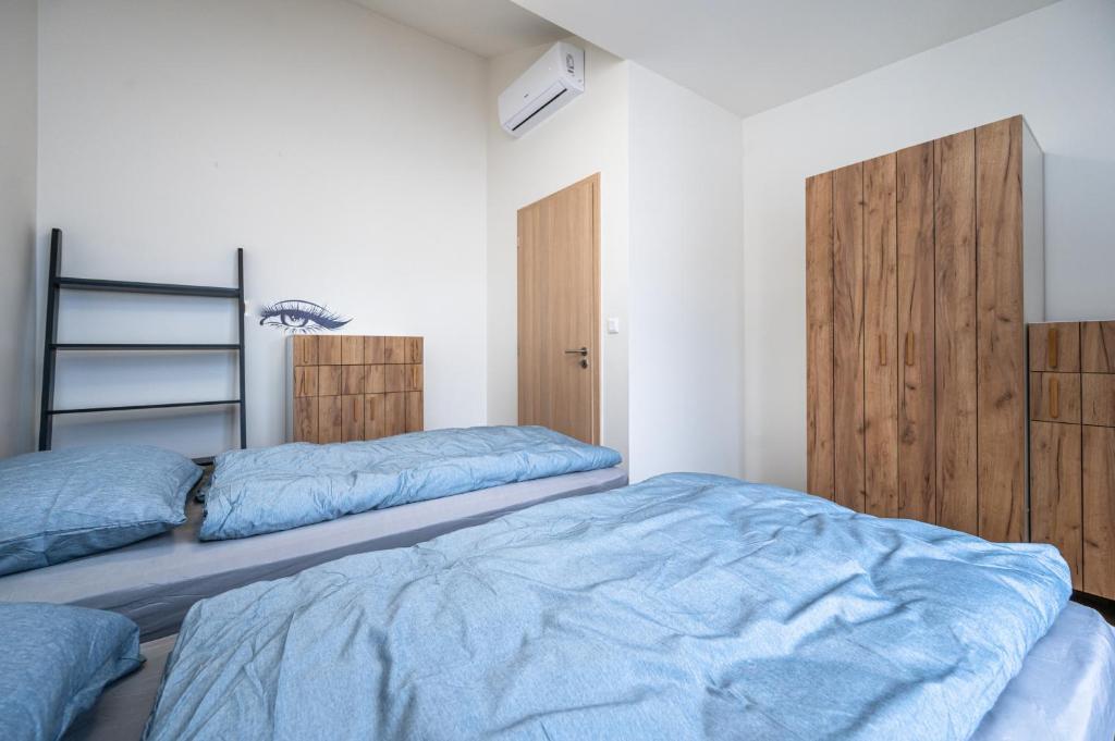 Łóżko lub łóżka w pokoju w obiekcie Folimanka Apartments