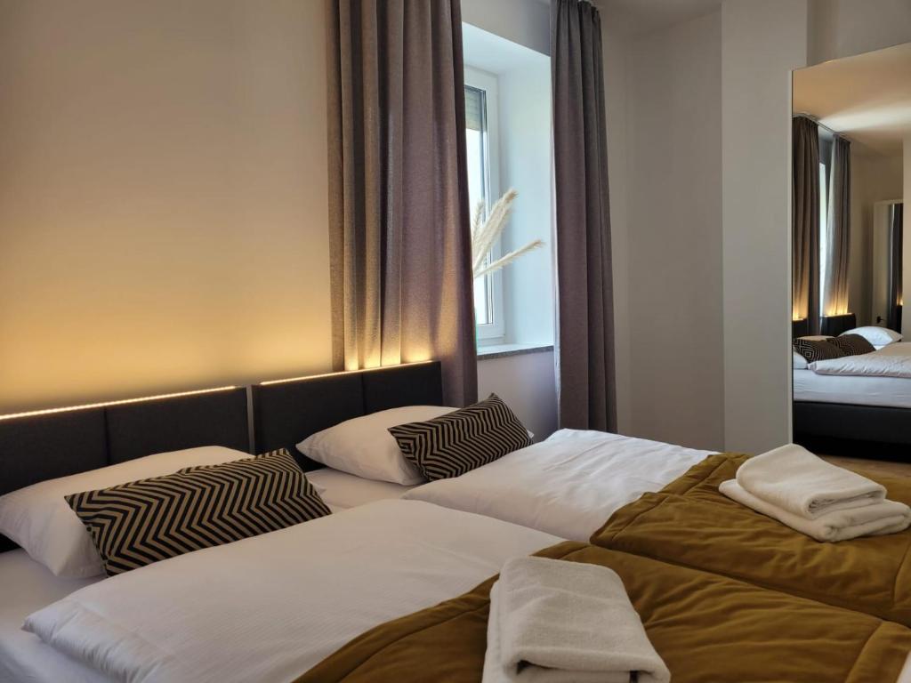 Posteľ alebo postele v izbe v ubytovaní Good Sleep