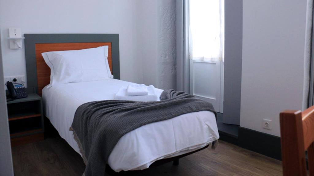 Postel nebo postele na pokoji v ubytování Aliança café & hostel
