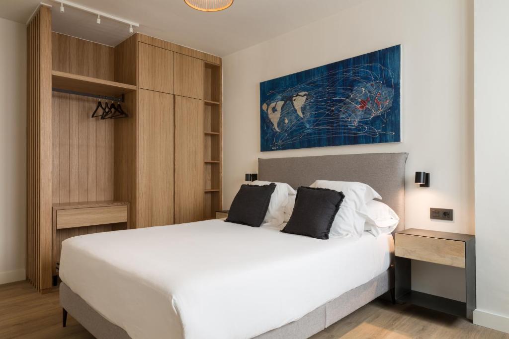 Posteľ alebo postele v izbe v ubytovaní Puerta Catedral Suites