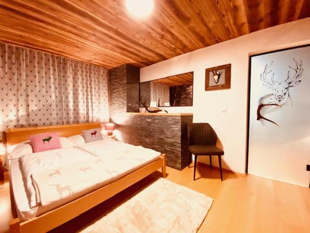 Postel nebo postele na pokoji v ubytování Wilderer Suiten Mariazell