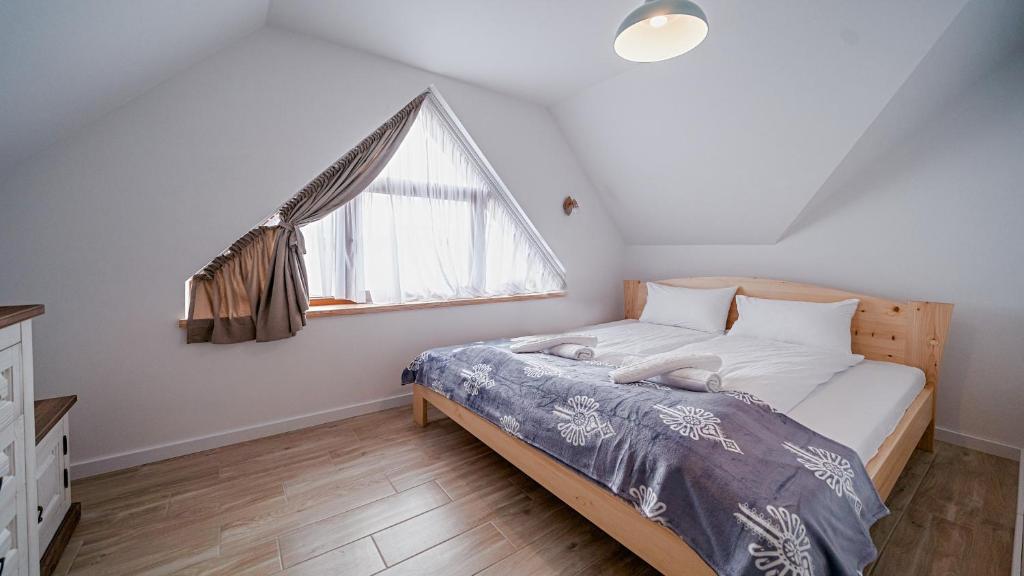 Postel nebo postele na pokoji v ubytování Apartamenty Sun & Snow Kaniówka