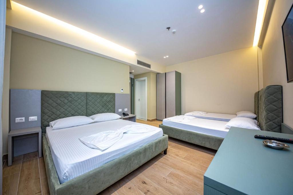 Postel nebo postele na pokoji v ubytování Hotel Bella Vista