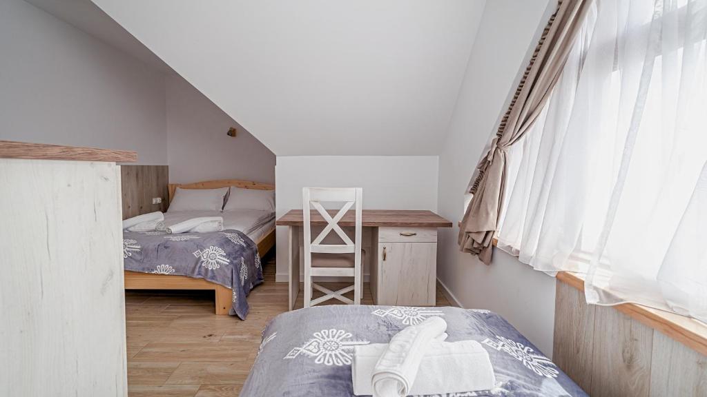 Postel nebo postele na pokoji v ubytování Apartamenty Sun & Snow Kaniówka