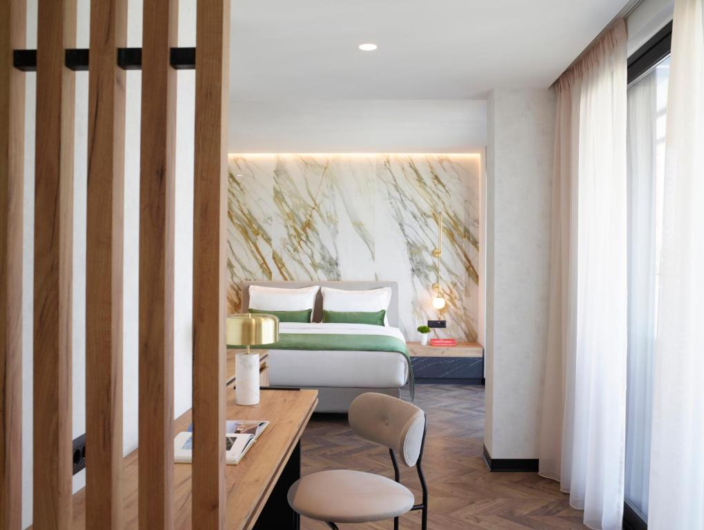 A bed or beds in a room at The Port Square Hotel