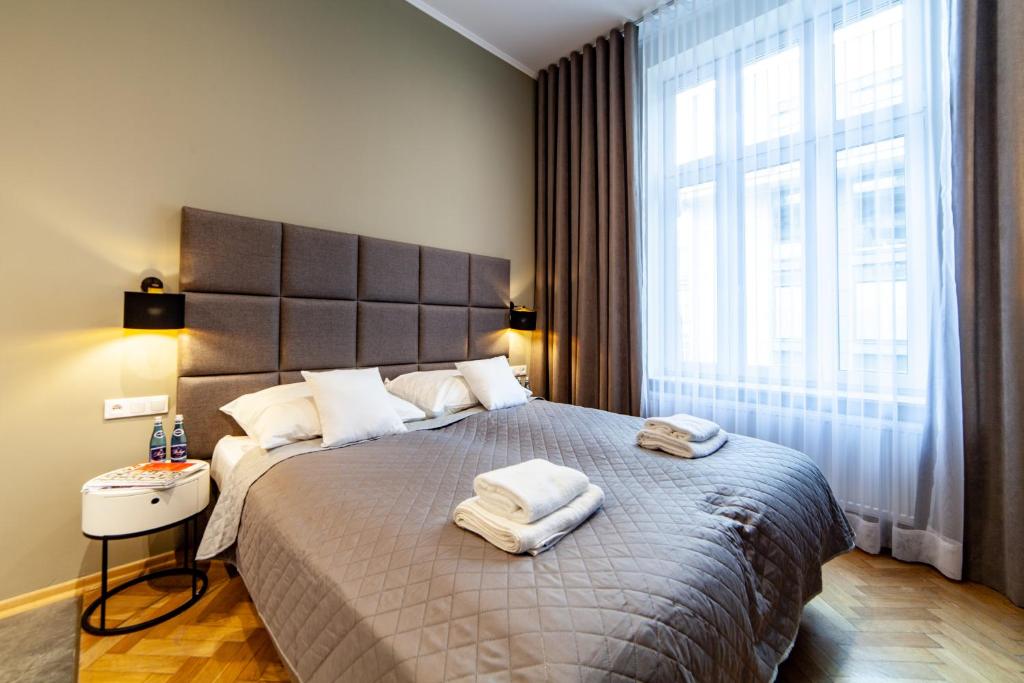 Posteľ alebo postele v izbe v ubytovaní MILU Apartments Kurkowa
