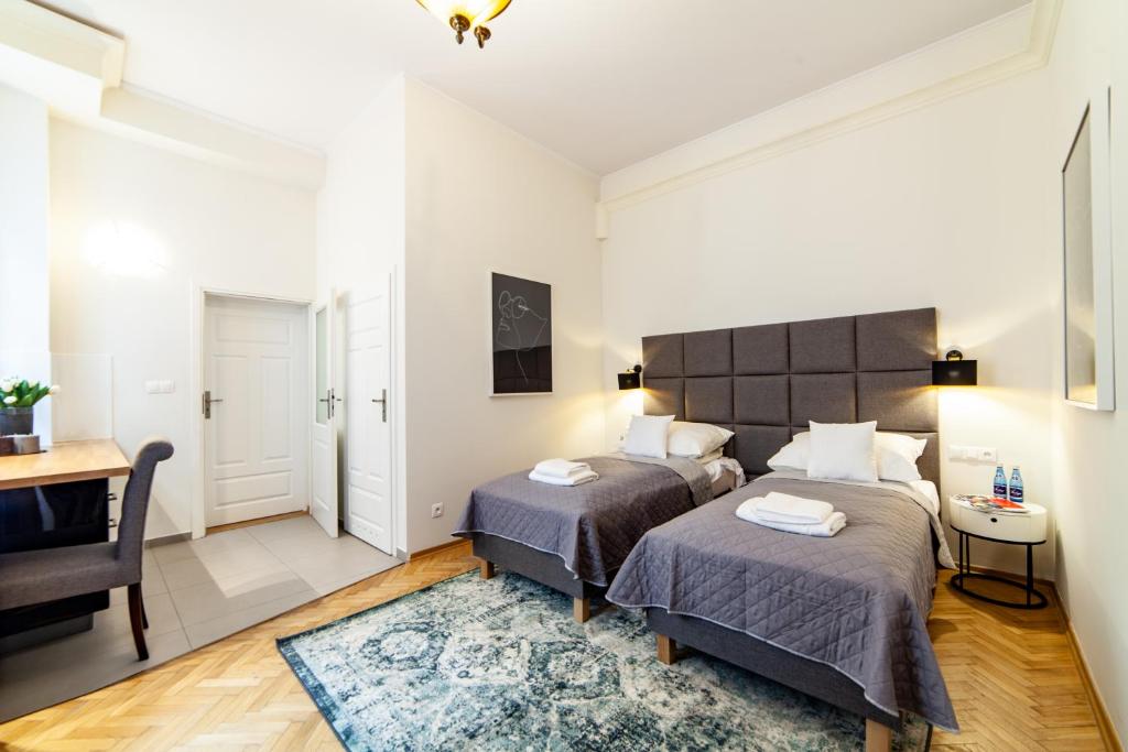 Posteľ alebo postele v izbe v ubytovaní MILU Apartments Kurkowa