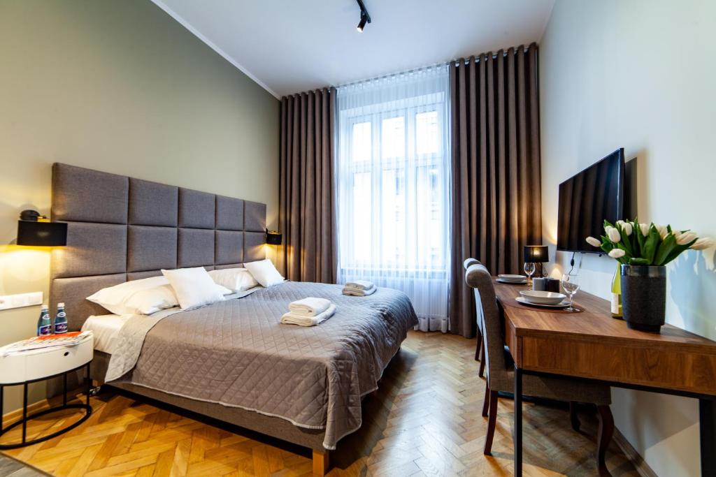 Posteľ alebo postele v izbe v ubytovaní MILU Apartments Kurkowa