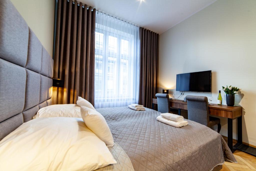 Posteľ alebo postele v izbe v ubytovaní MILU Apartments Kurkowa