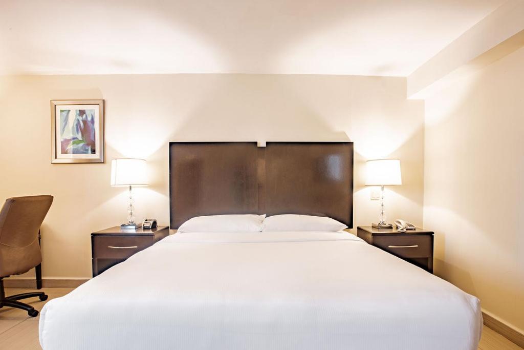 Uma cama ou camas num quarto em Studio Coliving Hotel