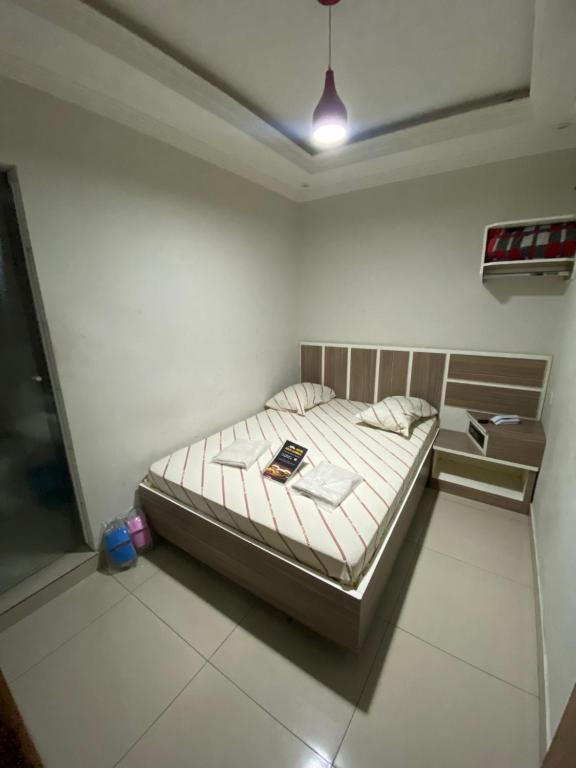 Postel nebo postele na pokoji v ubytování Hotel Cumbica Guarulhos