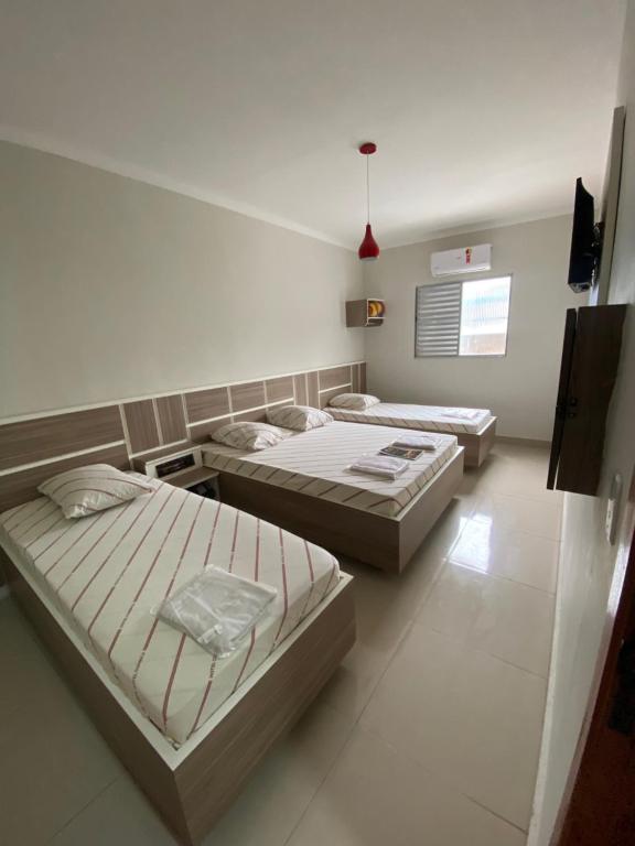Postel nebo postele na pokoji v ubytování Hotel Cumbica Guarulhos