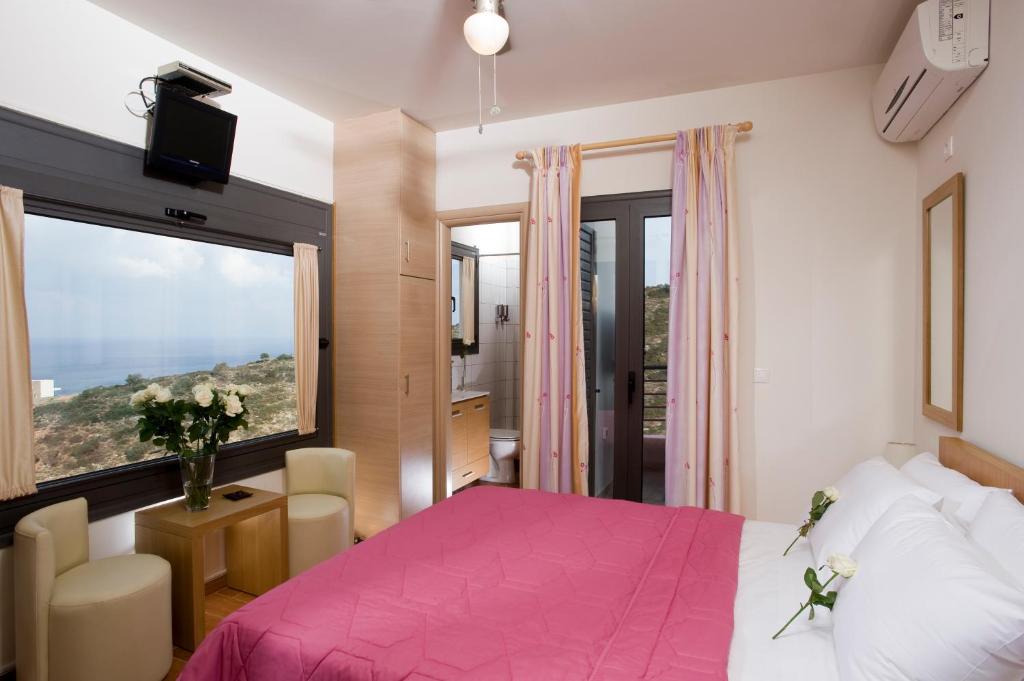 Postel nebo postele na pokoji v ubytování Elounda Solfez Villas