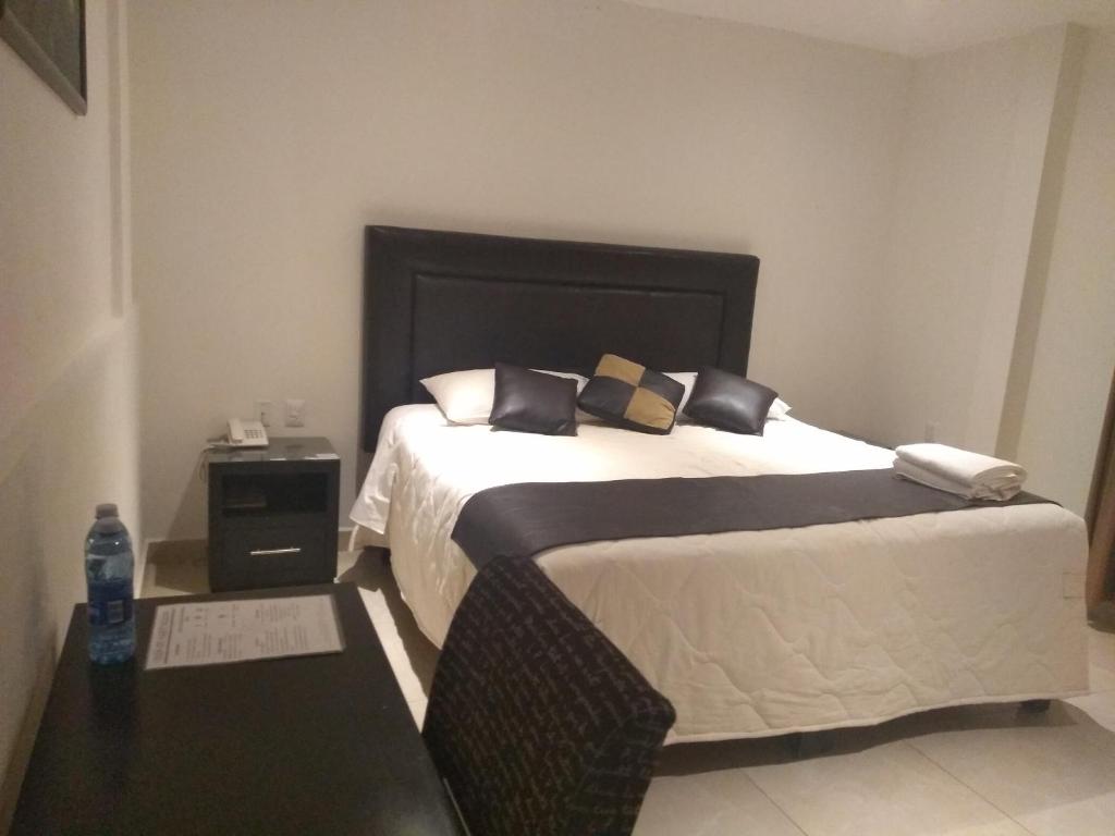 Postel nebo postele na pokoji v ubytování Hotel Anber