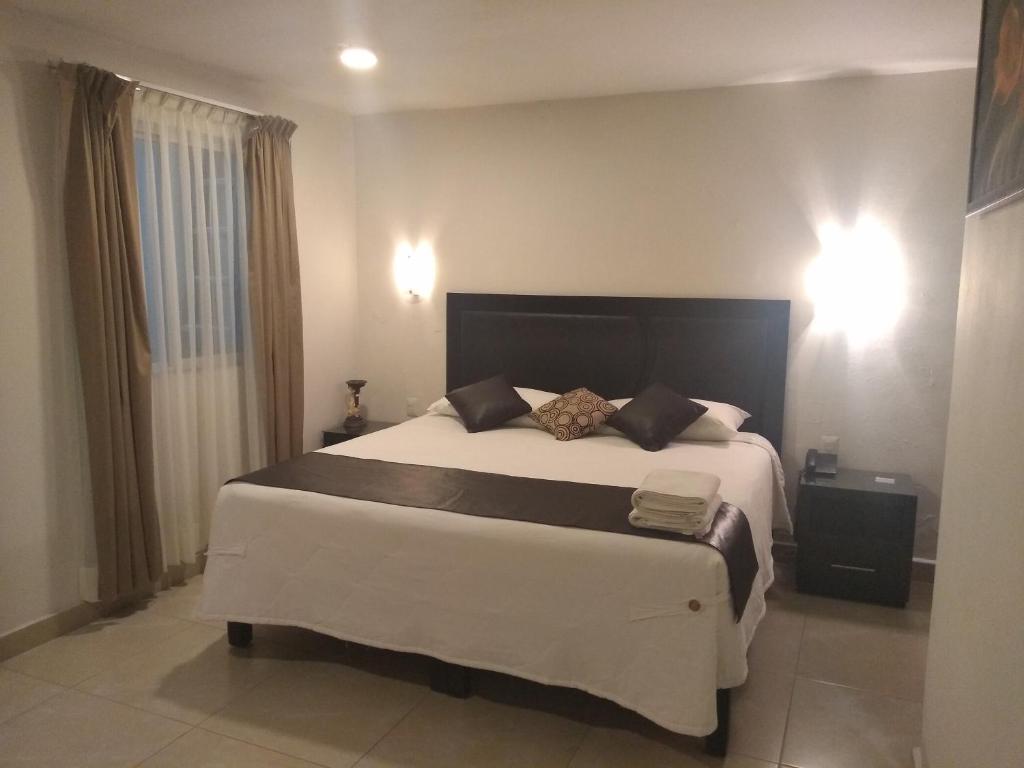 Postel nebo postele na pokoji v ubytování Hotel Anber