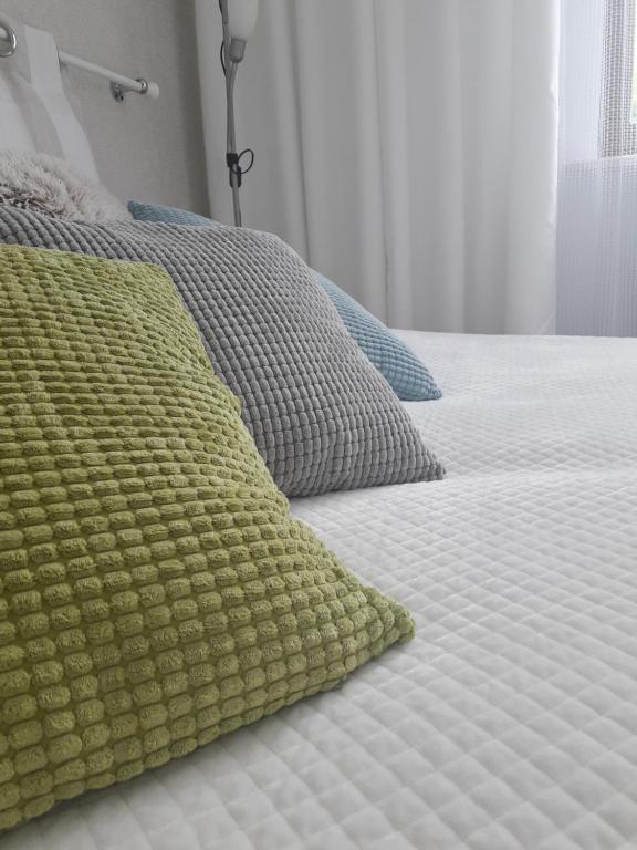 Posteľ alebo postele v izbe v ubytovaní Apartament nad Jeziorakiem