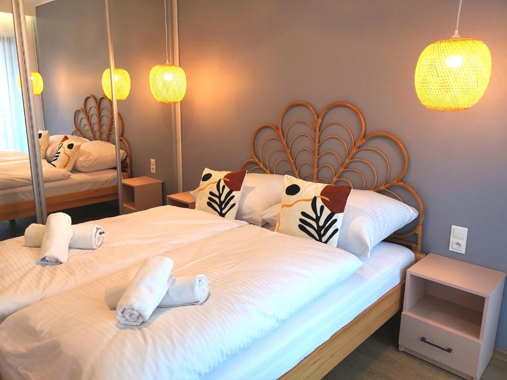 a bedroom with two beds with stuffed animals on them at Apartament Pod Papugami Karpatia Resort in Karpacz