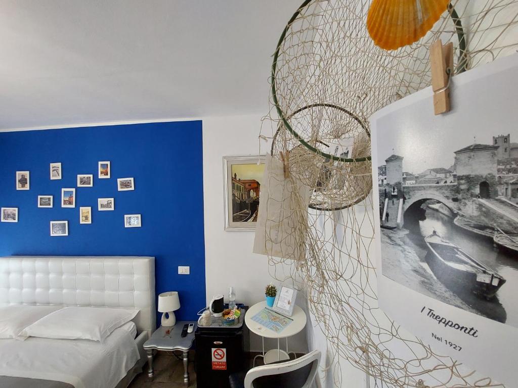 Postel nebo postele na pokoji v ubytování B&B Comacchio