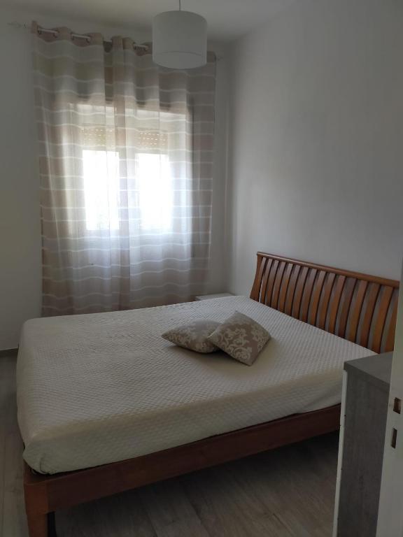 Łóżko lub łóżka w pokoju w obiekcie Casa Punta d'Oro
