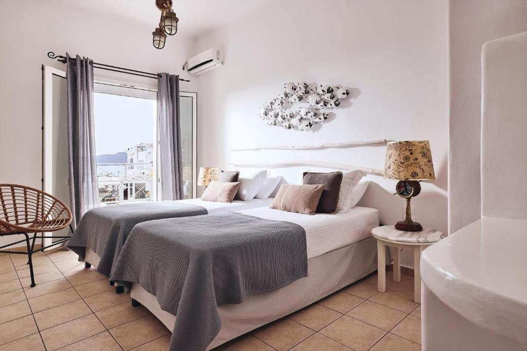 A bed or beds in a room at Capetan Giorgantas