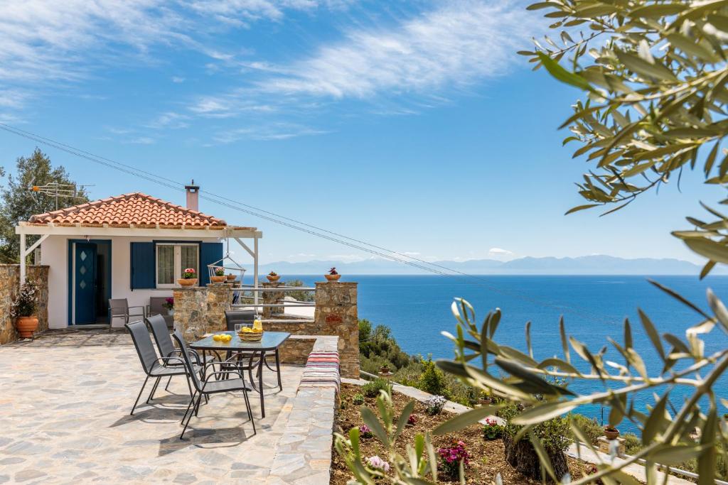 a villa with a view of the ocean at Kyklamino Home - Sea View, Quietly Defined in Skopelos Town