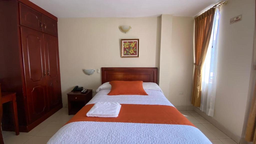 Postel nebo postele na pokoji v ubytování Hotel Caluva