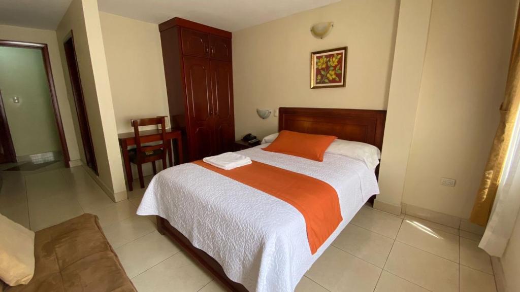 Postel nebo postele na pokoji v ubytování Hotel Caluva