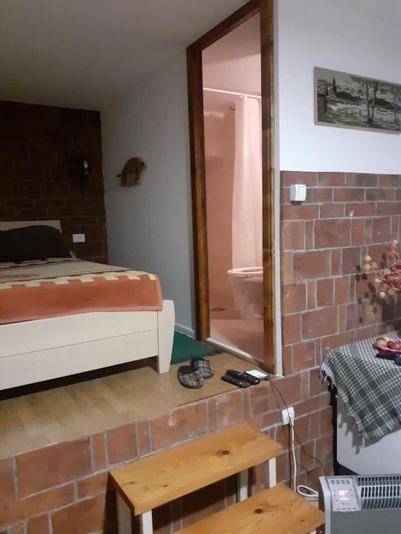 Postel nebo postele na pokoji v ubytování Bovanski Vidikovac