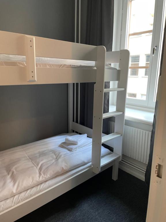 Postel nebo postele na pokoji v ubytování Birka Hotel