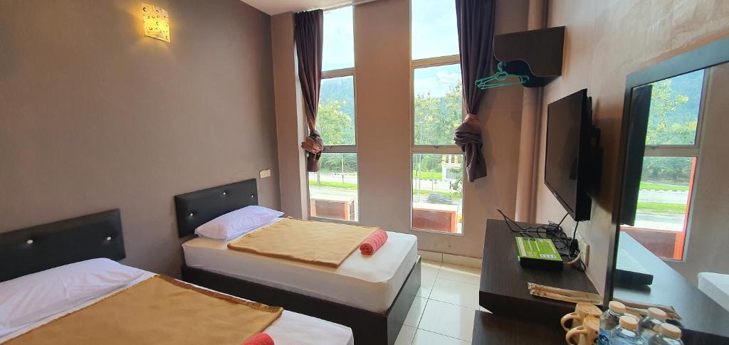 TV a/nebo společenská místnost v ubytování CK Hotel