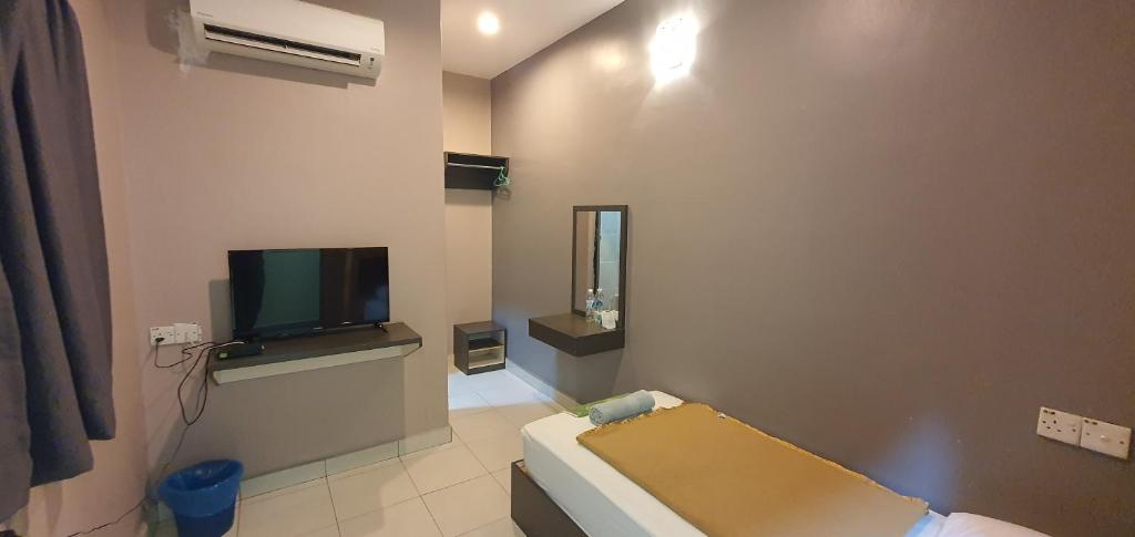 TV a/nebo společenská místnost v ubytování CK Hotel