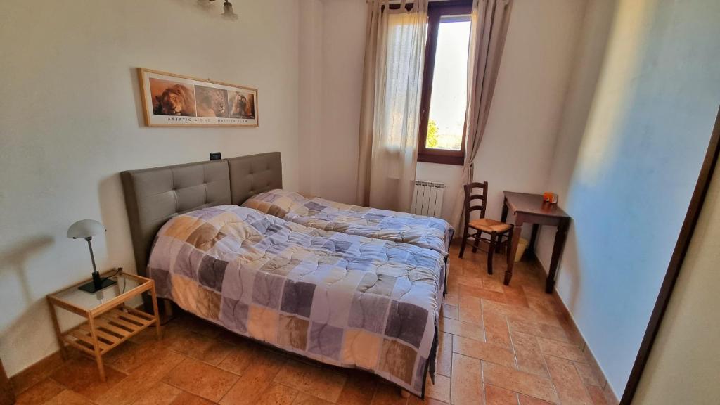 A bed or beds in a room at Appartamento spazioso Le Vitterelle B&B