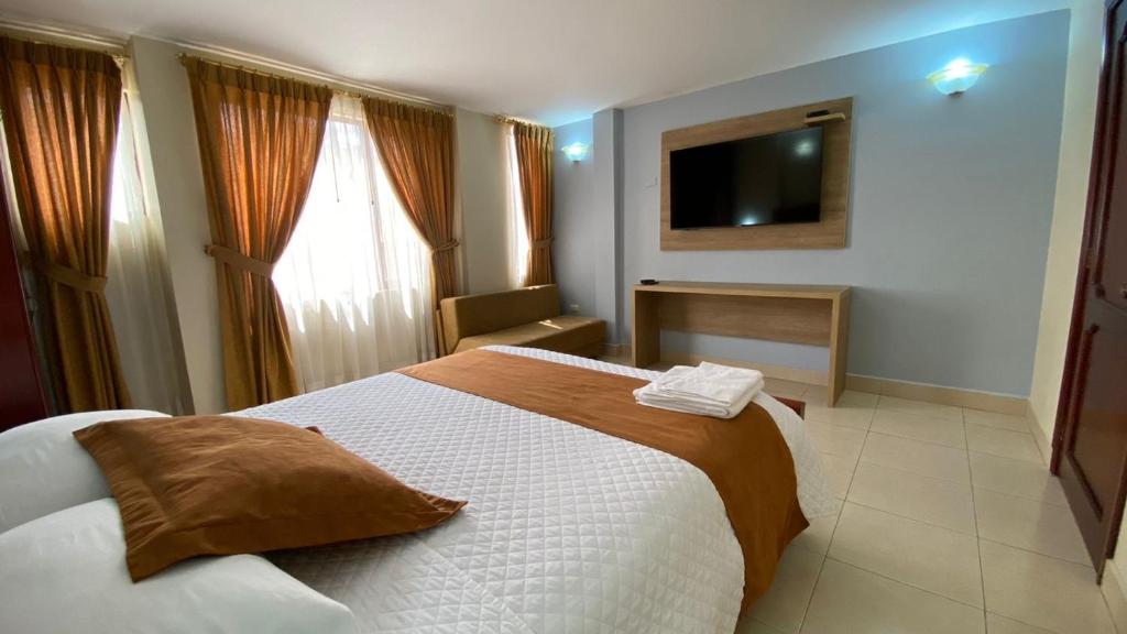 Postel nebo postele na pokoji v ubytování Hotel Caluva