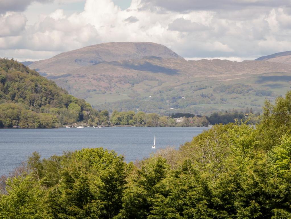 a view of a lake with a boat in the water at Howgill Lodge in Kendal