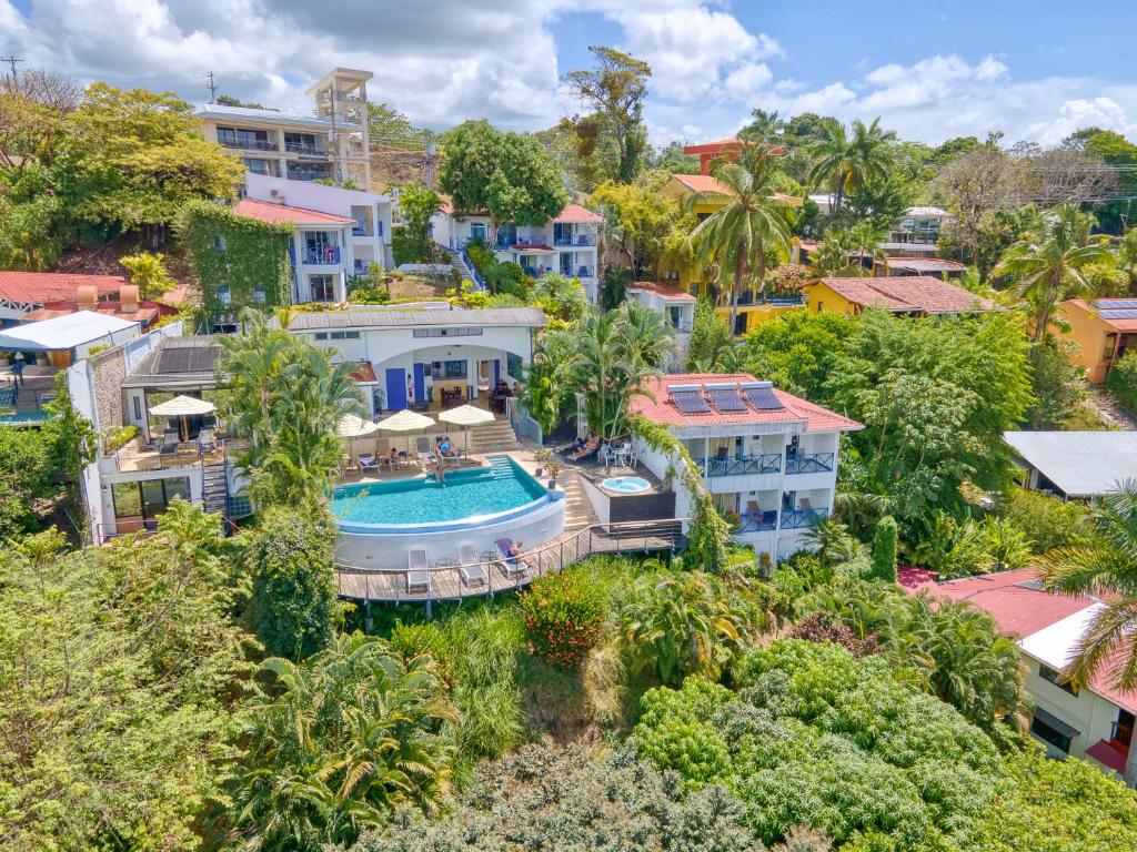 an aerial view of a house with a swimming pool at Villa Roca Boutique Resort & Suites - ADULT ONLY in Manuel Antonio