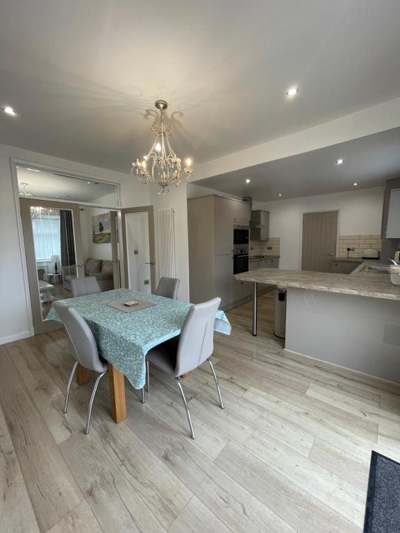 a kitchen and dining room with a table and chairs at The Villas holiday homes in Horden